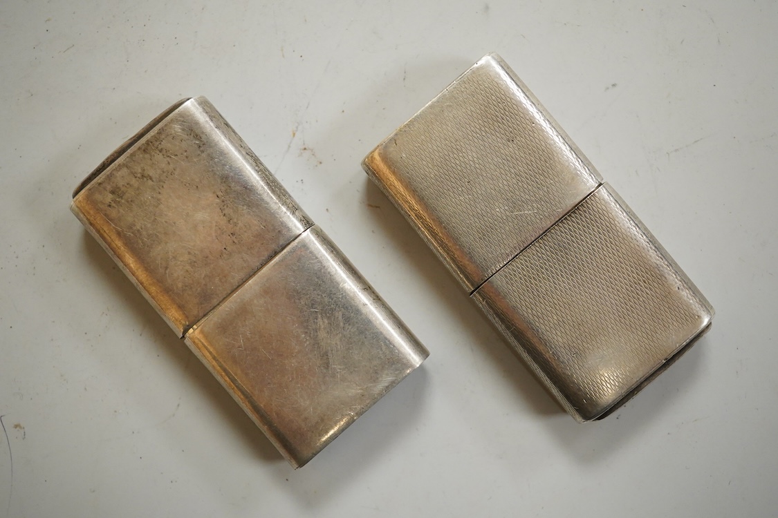 A near pair of George VI silver mounted lighters, each inscribed 'The Howitt Lighter', by Dudley Russell Howitt, Sheffield, 1946, (one engine turned), 58mm.